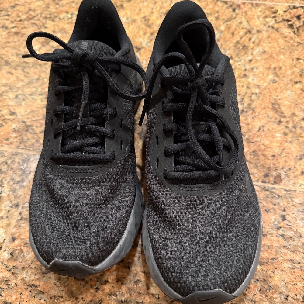 Nike Women's running shoes. These shoes say size 7 but fit like a 6.5
